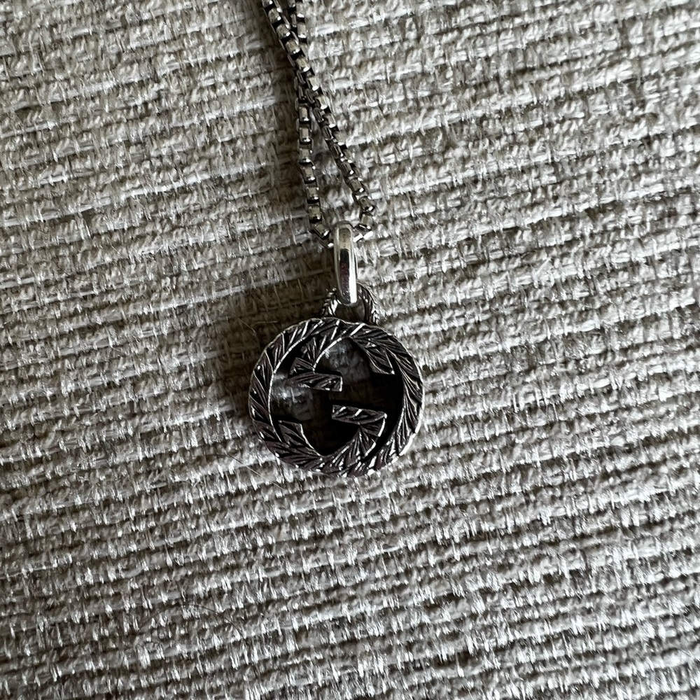 Authentic Gucci interlocking G charm with chain included